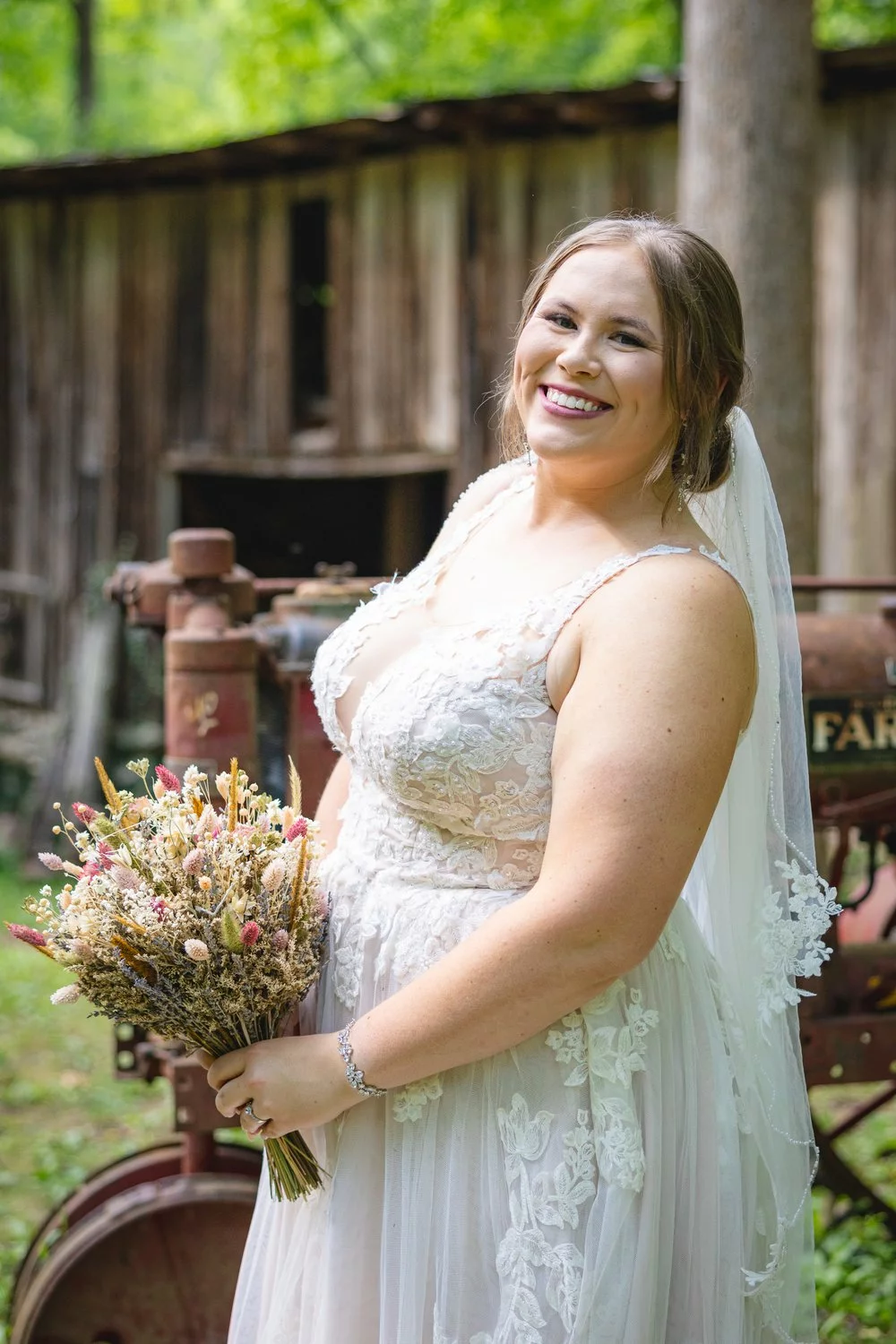 smiling bride with bouquet