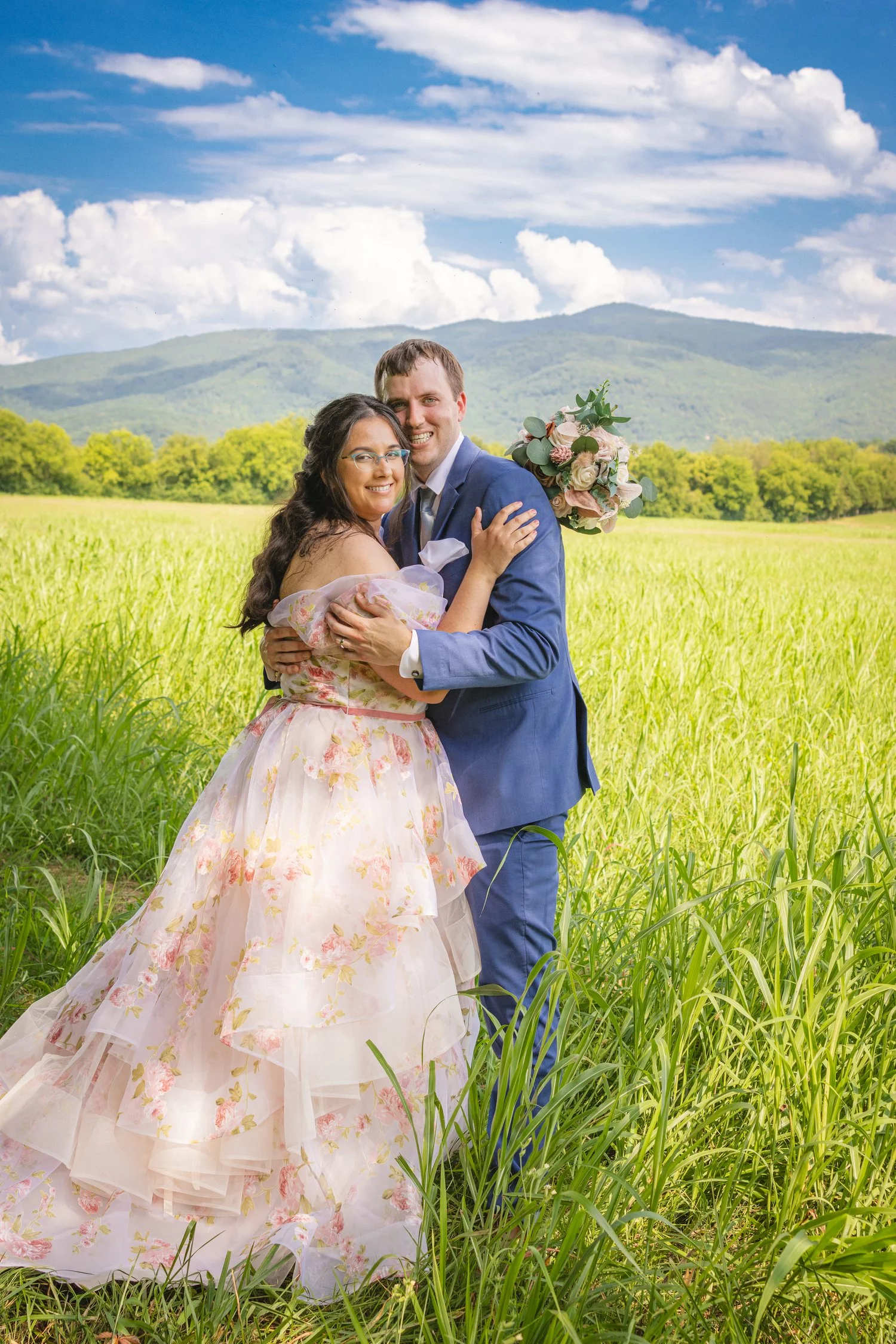 bride and groom in field
