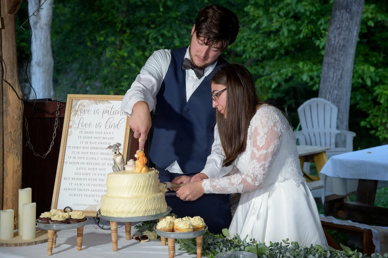 bride and groom cutting cake
