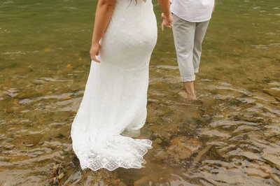 married couple walking in river
